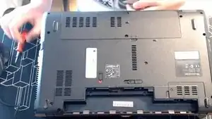 <strong>Remove the screws from the HDD and RAM compartment</strong>