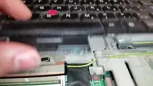 Pull up on the two little tabs jutting towards the screen to pull the keyboard connector off of the motherboard.