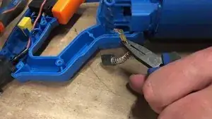 With pliers disconnect the carbon.